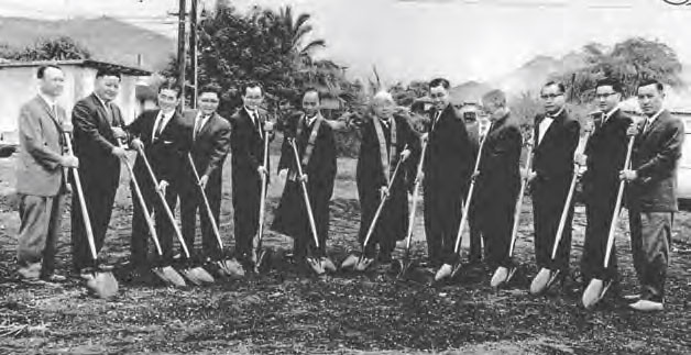 Ministers pose with shovels at the School St site prior to constuction