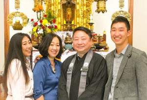 Rev. Shindo Nishiyama and family with the altar in the background