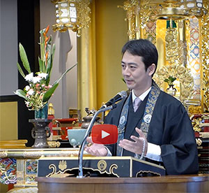 Rev. Umitani at Moiliili Hongwanji - video still with YouTube play button